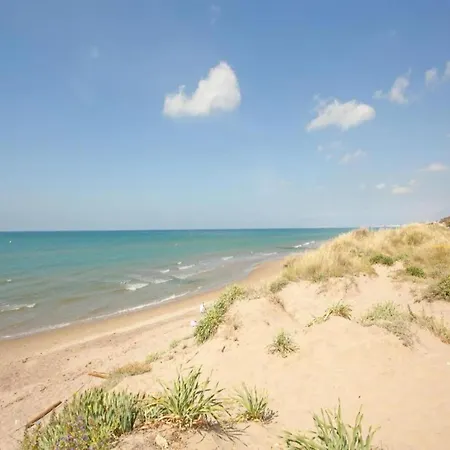 In Steps From Sandy *