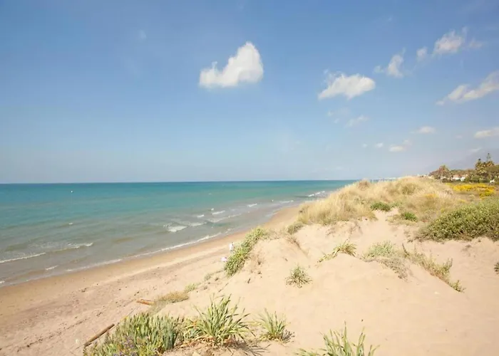 In Steps From Sandy *